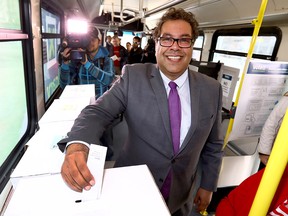 Naheed Nenshi casts his ballot at an advance voting station set up on a transit bus on Oct. 10, 2017.