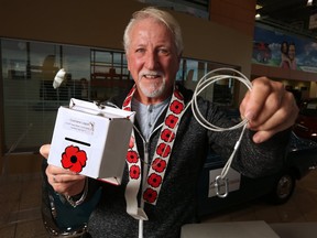 Cochrane resident Dan Kroffat is hoping the theft resistant poppy box he created last year will be used by more legions across the country. Kroffat was photographed at Cochrane Toyota on Tuesday October 24, 2017, the dealership sponsored 50 of the boxes for the town. Gavin Young/Postmedia