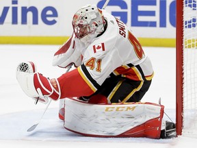Flames goalie Mike Smith blocks a shot during the second period in Anaheim on Oct. 9, 2017.