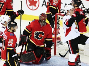 Calgary Flames goaltender Mike Smith reacts after giving up a goal to the Ottawa Senators during NHL hockey at the Scotiabank Saddledome in Calgary on Friday, October 13, 2017.