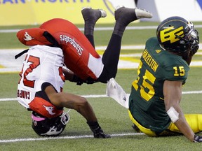 Calgary Stampeders defensive back Tommie Campbell (left) and Edmonton Eskimos wide receiver Vidal Hazelton (right) look for the ball during Canadian Football League game action in Edmonton on Saturday October 28, 2017. (PHOTO BY LARRY WONG/POSTMEDIA)