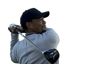 In this Jan. 25 file photo, Tiger Woods tees off at the Pro-Am component of the Farmers Insurance Open in San Diego.