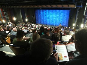 Patrons wait for the curtain to rise at Vertigo Theatre