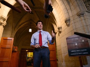Prime Minister Justin Trudeau speaks to media before a special caucus meeting on Parliament Hill, in Ottawa on Monday.