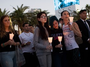 Mourners attend a candlelight vigil in Las Vegas for the victims of Sunday night's mass shooting.