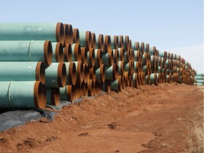 FILE - In this Feb. 1, 2012 file photo, miles of pipe ready to become part of the Keystone Pipeline are stacked in a field near Ripley, Okla. It was a nice story while it lasted. Moments from signing orders to advance the stalled Keystone XL and Dakota Access pipelines, President Donald Trump comes up with the idea of making the projects use pipes and steel made in the U.S. He inserts a "little clause" to that effect and vows the projects will only happen if his buy-American mandate is met.  (AP Photo/Sue Ogrocki, File) ORG XMIT: WX108

FEB. 1, 2012 FILE PHOTO
Sue Ogrocki, AP