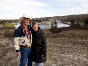 Bob and Gina Church outside their home near the Hamptons golf course in Calgary on Wednesday November 29, 2017. Leah Hennel/Postmedia