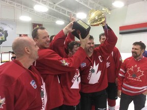 Calgary Canadian Citizens hockey team hoist a trophy from the first-ever Costa Rican hockey tournament, which they won on Sunday, Nov. 19, 2017. Supplied photo