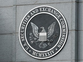 The U.S. Securities and Exchange Commission seal hangs on the facade of its building in Washington, DC.