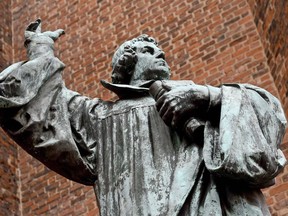 A bronze statue of German theologian Martin Luther outside the Marktkirche (Market Church) in Hannover, Germany.