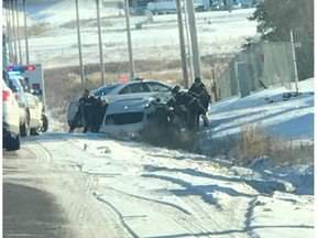 A crash in Nisku on Monday that ended with five naked people in police custody began with a kidnapping, RCMP said Tuesday.