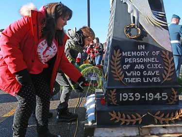 Calgarians place poppies at the cenotaph during Remembrance Day ceremonies at the Military Museums in Calgary on  Saturday November 11, 2017.