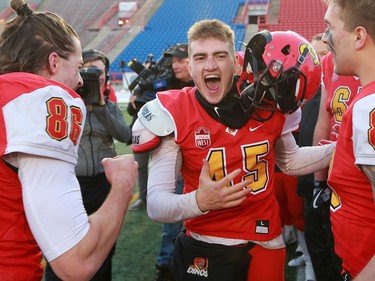 U of C Dinos kicker Niko Difonte celebrates after his 59 yard field goal in the final seconds cinched the game over the UBC Thunderbirds 44-43.