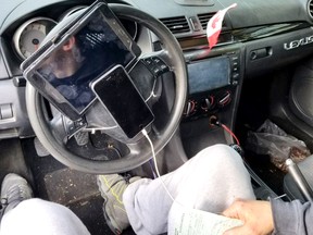 Driving with a table and iPhone fastened to his steering wheel earned this motorist a $368 fine.