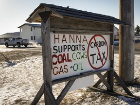 Residents of Hanna, Alta., have erected a sign showing their feelings about government policies as seen on Tuesday, Dec. 13, 2016.