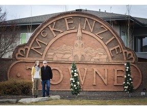 City Hall reporter Annalise Klingbeil and Ward 12 Coun. Shane Keating pose in front of the McKenzie Towne sign. The two toured Calgary's deep south for episode 13 of The Confluence.