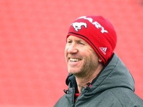 Calgary Stampeders head coach Dave Dickenson shares a laugh during practice in preparation for the CFL Western Final in Calgary on Wednesday, Nov. 15, 2017.