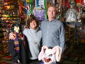 Dave and Bernadette Fletcher, owners of Chuckles, pose in their southwest Calgary costume/ joke/ prop store Wednesday, November 15, 2017. After many years of being a fixture in Calgary, the popular store is closing. Jim Wells/Postmedia