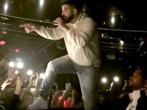 Drake threatens a man in the crowd during a concert in Sydney, Australia on Wednesday.