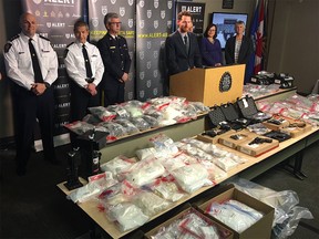 Seized drugs, weapons and body armour on display at an ALERT press conference in Calgary on Nov. 22, 2017.