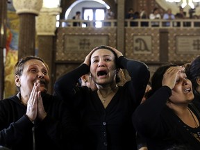 FILE - In this April 10, 2017 file photo, women cry during the funeral for those killed in a Palm Sunday church attack in Alexandria Egypt, at the Mar Amina church. Egypt has been battling an insurgency in the Sinai led by an affiliate of the Islamic State group that intensified after the militaryís 2013 ouster of the Muslim Brotherhood from power. Hundreds have been killed in what has become a grinding stalemate in Sinai. The militants have expanded their attacks to other parts of Egypt, carrying out deadly bombings of churches to terrorize the Christian minority and deadly gunbattles with security forces. (AP Photo/Samer Abdallah, File) ORG XMIT: CAIMA103