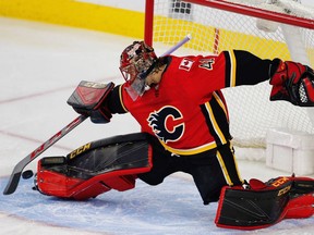Calgary Flames goaltender Mike Smith with a save against the New Jersey Devils during NHL hockey at the Scotiabank Saddledome in Calgary on Sunday, November 5, 2017.
