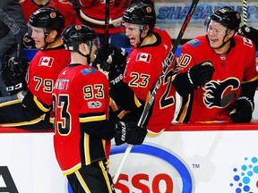 Calgary Flames Sam Bennett celebrates with teammates after scoring against the St. Louis Blues in NHL hockey at the Scotiabank Saddledome in Calgary on Monday, November 13, 2017.