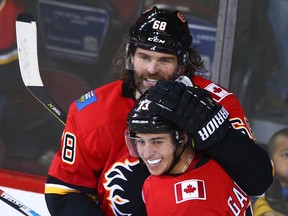 Jaromir Jagr celebrates his first Flames goal with teammate Johnny Gaudreau during NHL action between the Detroit Red Wings and the Calgary Flames in Calgary on Thursday, November 9, 2017.