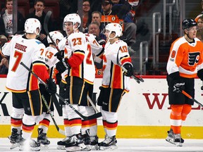 Sean Monahan #23 of the Calgary Flames celebrates his hattrick at 14:56 of the second period against the Philadelphia Flyers at the Wells Fargo Center on November 18, 2017 in Philadelphia,