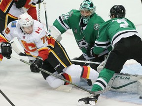 Calgary Flames left wing Micheal Ferland (79) tries to score against Dallas Stars goalie Ben Bishop (30) and defenseman Dan Hamhuis (2) during the first period of an NHL hockey game in Dallas, Friday, Nov. 24, 2017.