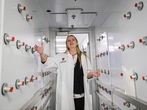 Dr. Kathy McCoy, director of the Western Canadian Microbiome Centre, stands in a sterilization chambers as she explains the purpose of the facility on a tour prior to it opening in Calgary on Thursday, Oct. 12, 2017.