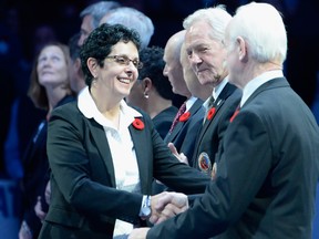 2017 Hockey Hall of Fame inductee Danielle Goyette is welcomed by Lanny McDonald and other current Hockey Hall of Fame members during a pre-game ceremony ahead of NHL hockey action between the Boston Bruins at Toronto Maple Leafs in Toronto on Friday, November 10, 2017.