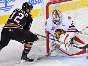 Mark Kastelic can't find the handle on a puck against the Portland Winterhawks in a Calgary Hitmen loss on Wednesday at the Saddledome.