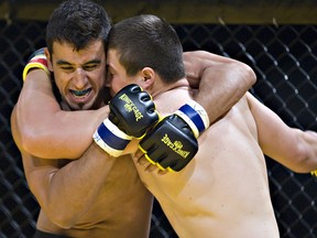 Chris Kizuik of Fort McMurray (left) fights Jeremiah Simonar of Cold Lake during King of the Cage Lockdown MMA action in Edmonton.