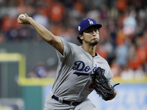 FILE - In this Oct. 27, 2017, file photo, Los Angeles Dodgers starting pitcher Yu Darvish, of Japan, throws against the Houston Astros during the first inning of Game 3 of baseball's World Series in Houston. Astros pitcher Lance McCullers Jr., with one victory since June, will start the World Series decider Wednesday, Nov. 1. The Dodgers' Darvish will be seeking redemption for a rough Game 3 start. (AP Photo/Matt Slocum, File)