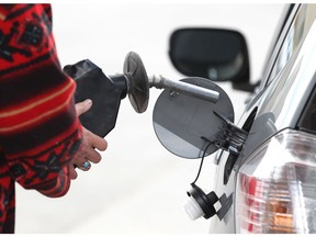 A driver pumps gas into her vehicle in Winnipeg on Mon., April 30, 2012. Provincial gas taxes were set to rise. JASON HALSTEAD/WINNIPEG SUN QMI AGENCY
Jason Halstead, Jason Halstead/Winnipeg Sun/QMI Agency