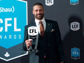 Edmonton Eskimos quarterback Mike Reilly, recipient of the Most Outstanding Player award, poses backstage on Nov. 23, 2017