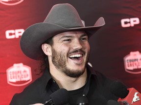 Calgary Stampeders linebacker Alex Singleton speaks to reporters at the airport in Ottawa, ahead of his team's Grey Cup match against the Toronto Argonauts, on Tuesday, Nov. 21, 2017.