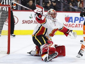 Calgary Flames' Mike Smith makes a save during the second period against the Philadelphia Flyers, Saturday, Nov. 18, 2017, in Philadelphia.