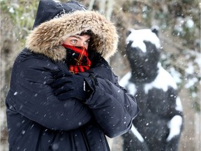 Julian Parsons was all bundled up as snow as Calgarians woke up to a blast of winter.