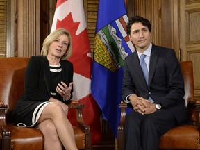 Prime Minister Justin Trudeau and Alberta Premier Rachel Notley speak during a meeting on Parliament Hill, Tuesday, Nov. 29, 2016 in Ottawa.