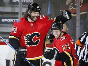 Jaromir Jagr celebrates his first goal as a Calgary Flame with teammate Johnny Gaudreau during the second period against the Detroit Red Wings on Thursday, Nov. 9, 2017.