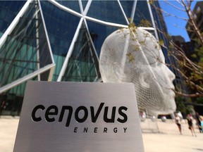 A Cenovus Energy sign is shown outside the Bow office tower in Calgary, Alta on Thursday July 30, 2015. Cenvus shares office space with a number of other businesses, mostly oil and gas related businesses. Jim Wells/Calgary Sun/Postmedia Network