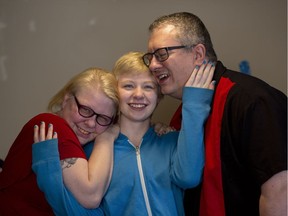 Flanked by her parents Kristy and Phil Bacon, Drew Shepherd has learned to cope with anxiety and depression.