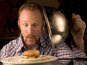 Filmmaker Morgan Spurlock poses with an 'Egg McMuffin.'
