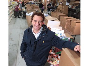 David Howard, president of the Canadian Legacy Project, stands in the busy Veterans Food Bank which has filled four warehouses. Howard says the organization is grateful for the overwhelming response of the Calgary community.