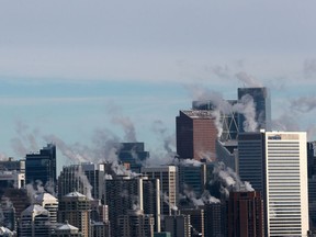 Steam rises from downtown Calgary buildings on a cold Boxing Day 2017.