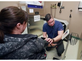 Registered nurse Andrew Lim checks blood pressure at the Renfrew Recovery Centre on Thursday, Nov. 30, 2017. Gavin Young/Postmedia