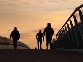 Calgarians cross the new 12th Street Bridge in Inglewood at sunset after it opened on Saturday December 9, 2017.  Gavin Young/Postmedia