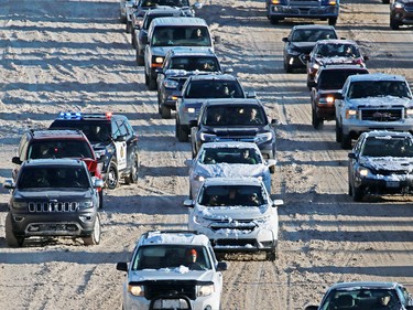 Police deal with a minor collision on a snowy Glenmore Trail on Wednesday December 20, 2017. An overnight winter storm hit Calgary leading to multiple crashes around the city.